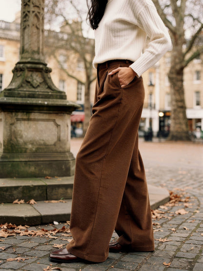 Womens corduroy wide-leg trousers in Tobacco worn on the cobbles of an English market square
