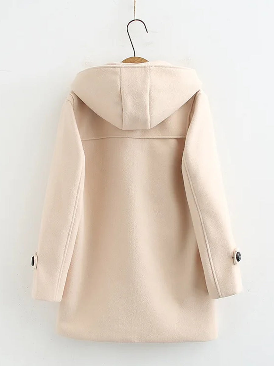 Back view of the cream hooded coat, plain back with no vent and a buttoned tab at each cuff