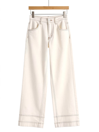 Cream jeans on a wooden hanger, front view, high-rise wide leg with camel contrast stitching