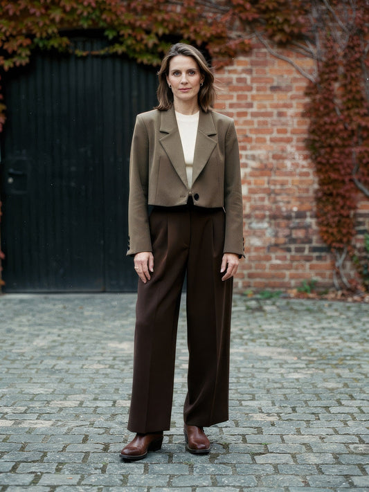 Womens cropped blazer in Bracken brown worn open in a brick courtyard