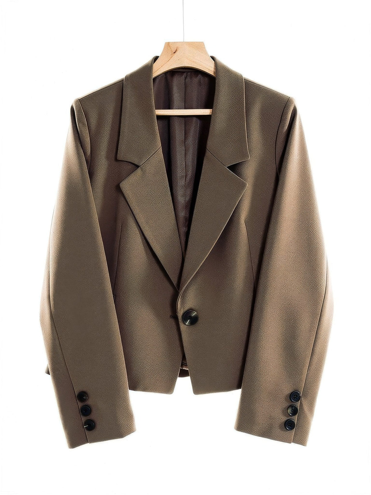 Cropped blazer in Bracken brown on a wooden hanger, front view