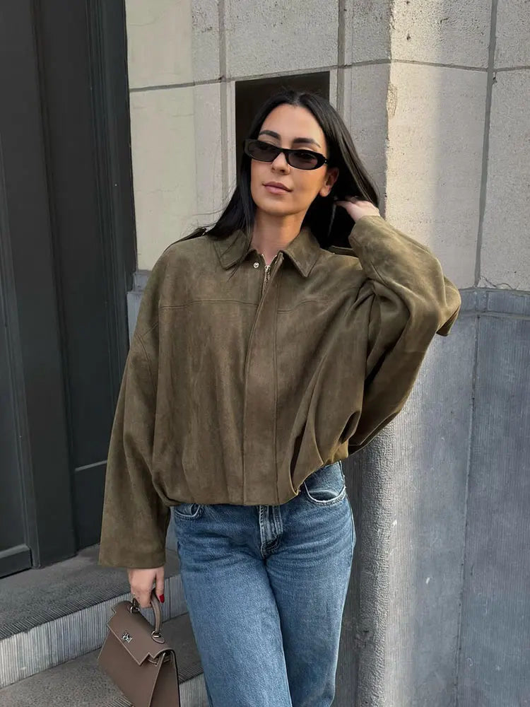 Khaki cropped faux-suede jacket worn with jeans, three-quarter view