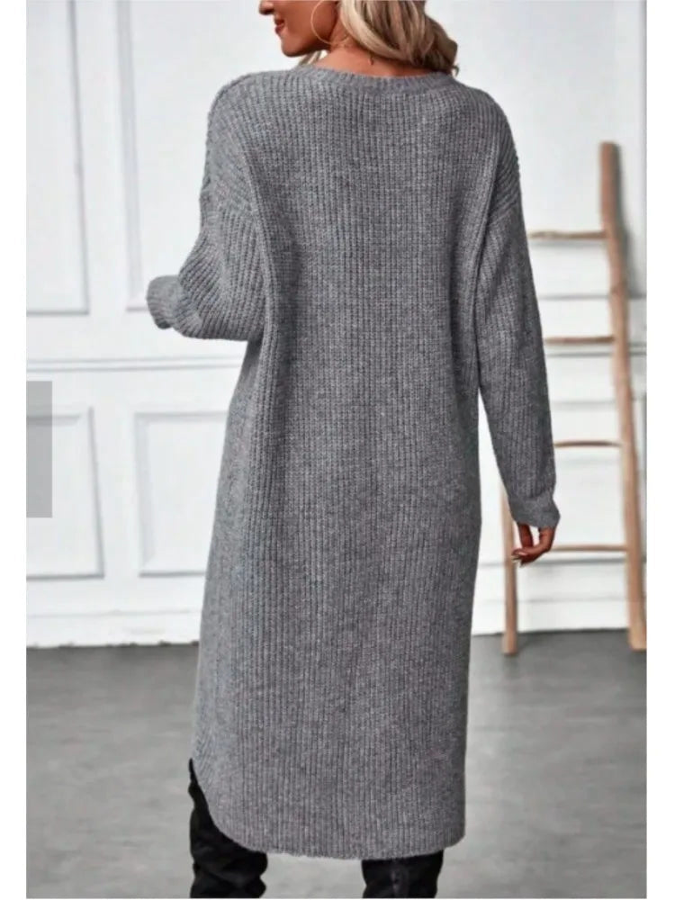 Back view of the grey marl rib-knit jumper dress worn full length