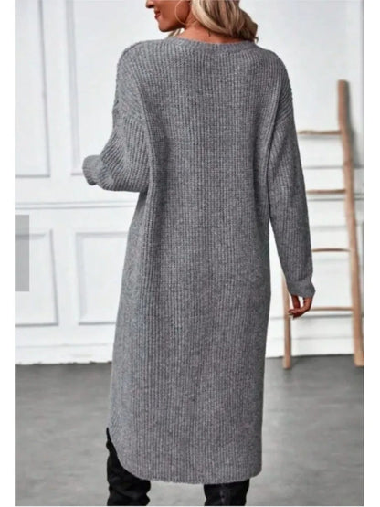 Back view of the grey marl rib-knit jumper dress worn full length