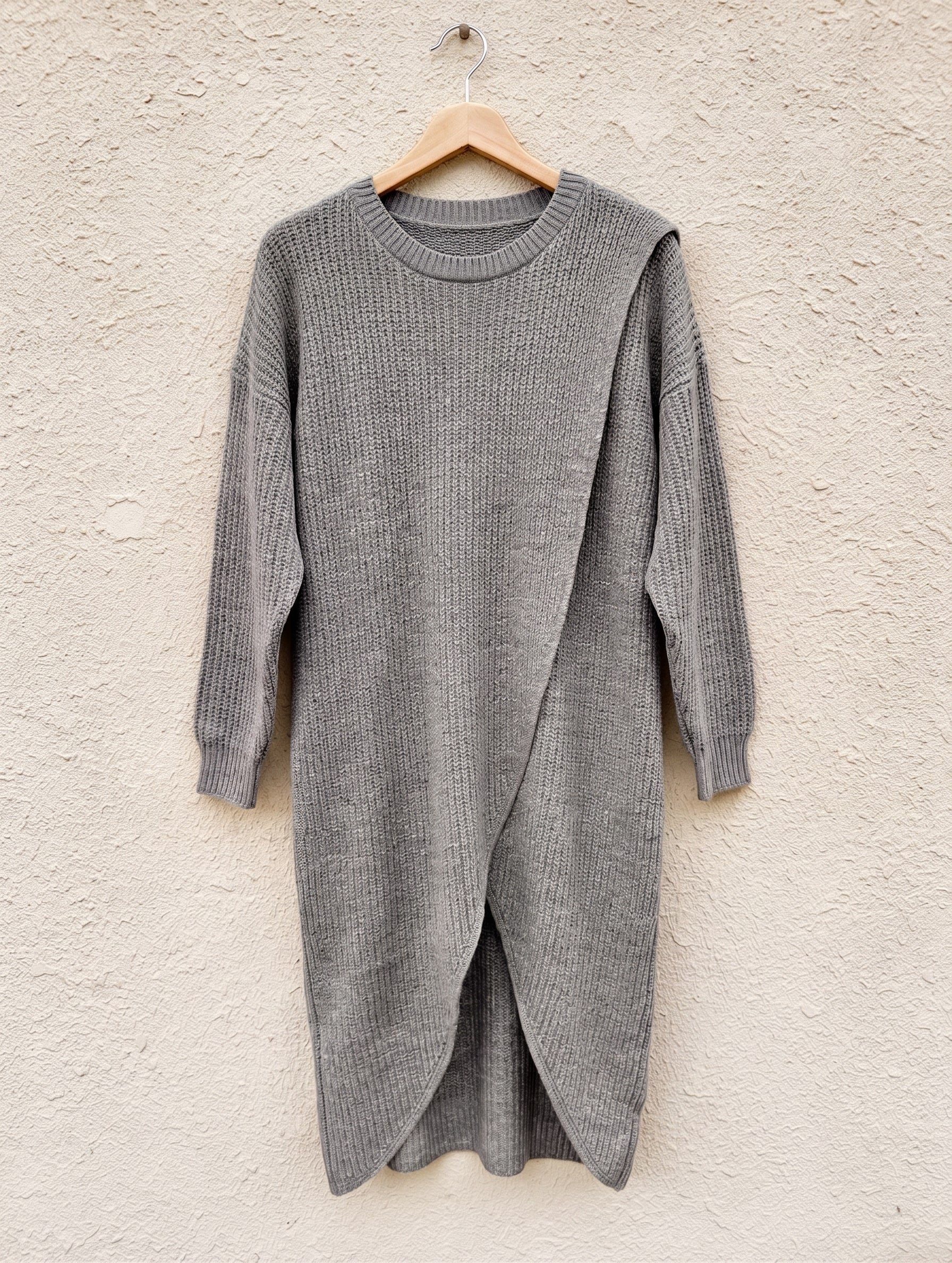 Grey marl crossover-hem rib-knit jumper dress on a wooden hanger