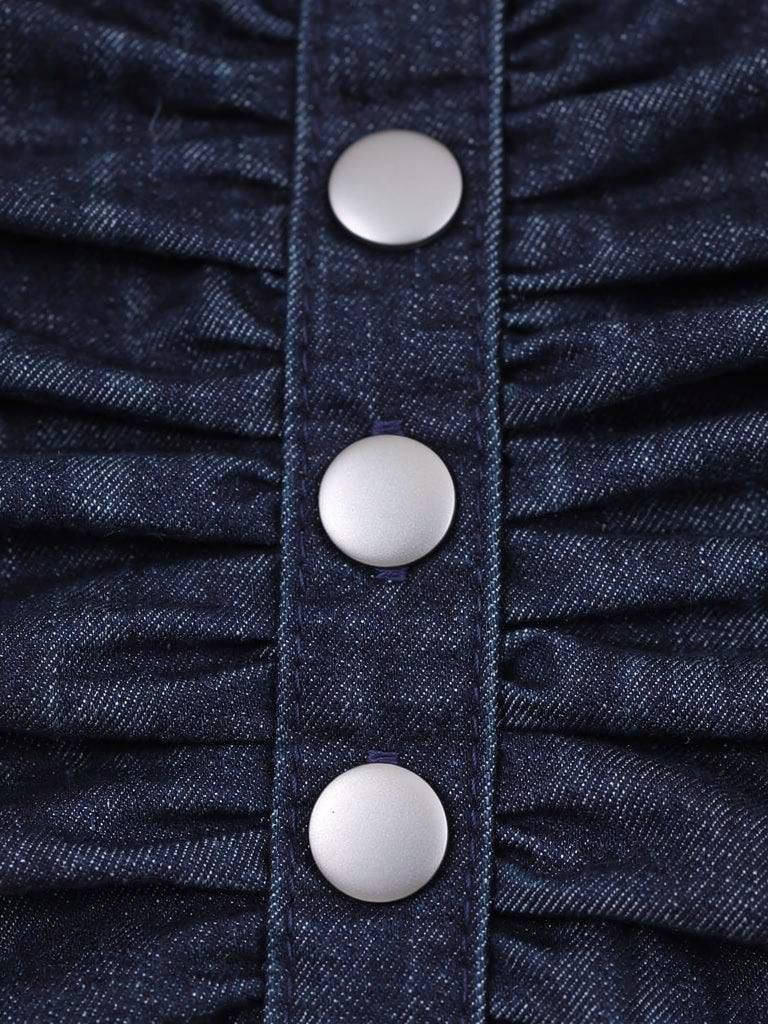 Close up of the indigo denim twill, ruched waist and snap buttons