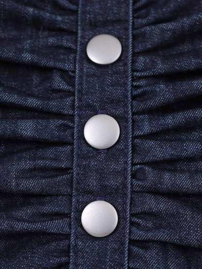 Close up of the indigo denim twill, ruched waist and snap buttons