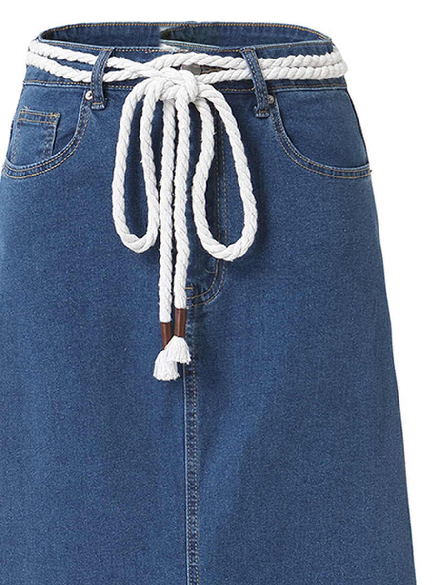 Close view of the denim maxi skirt waistband, belt loops and the woven ecru rope belt tied at the front