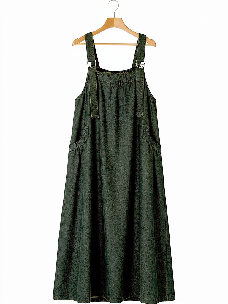 Fern Wash denim pinafore dress on a hanger, sleeveless dungaree dress
