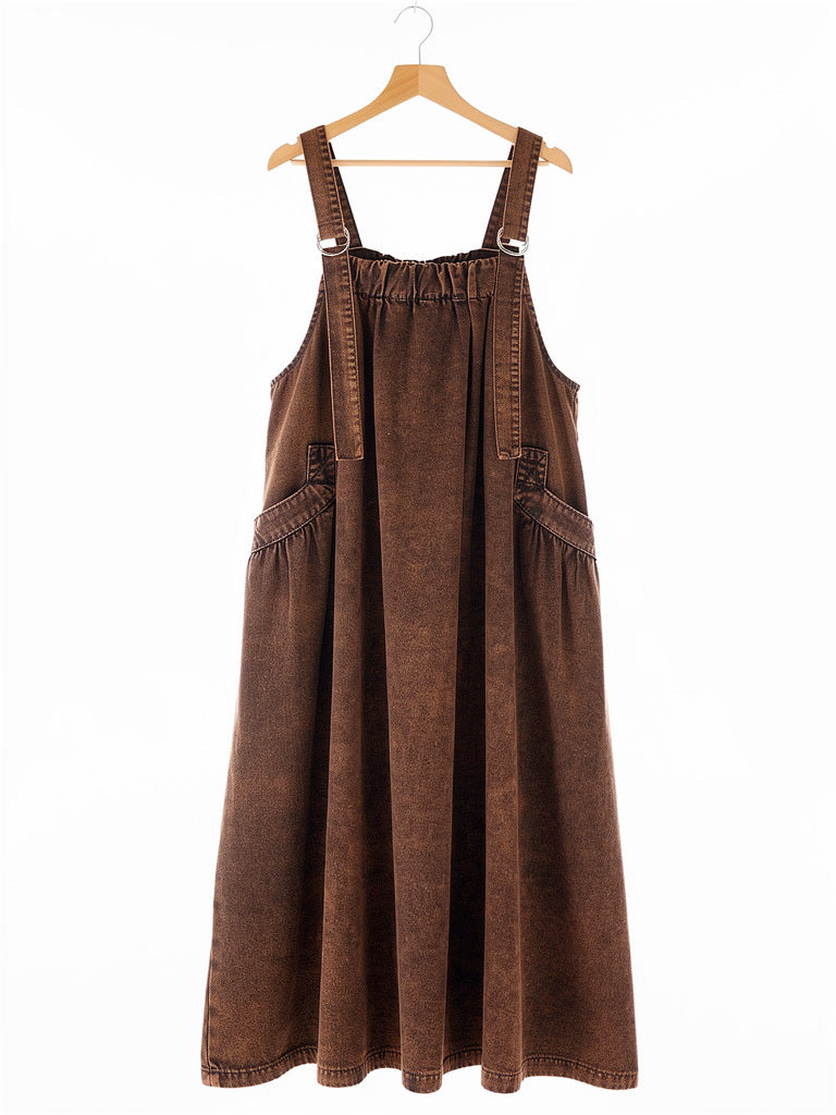 Rust Wash denim pinafore dress on a hanger, square bib and ring straps