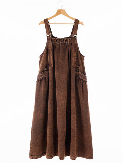 Rust Wash denim pinafore dress on a hanger, square bib and ring straps