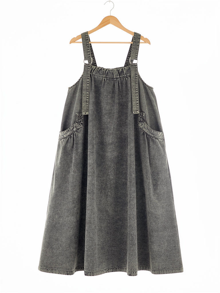 Slate Wash denim pinafore dress on a hanger, washed A-line maxi