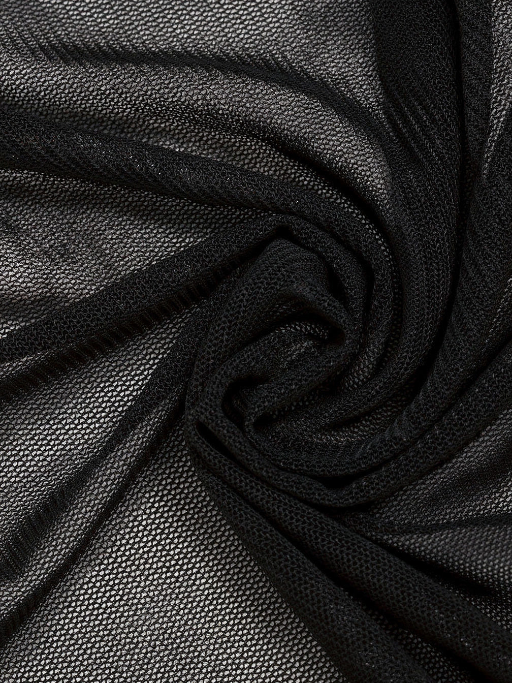 Close up of the fine black stretch mesh the draped top is cut from