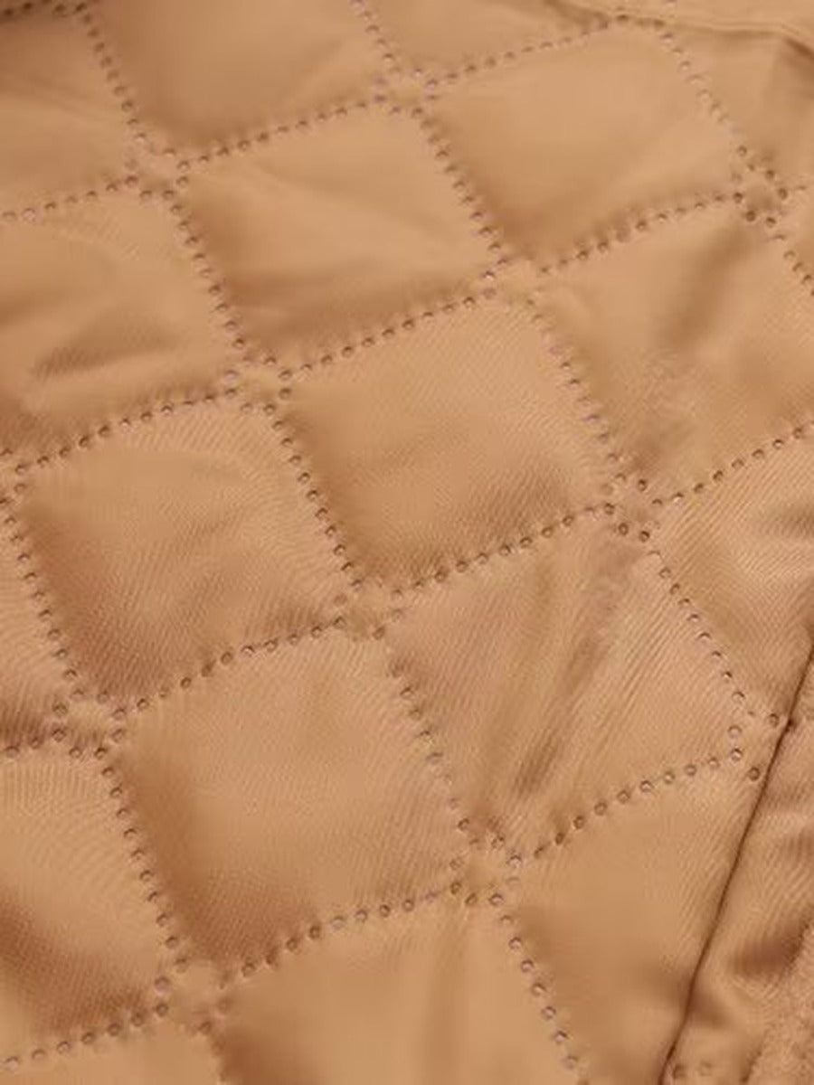 Diamond quilted lining inside a camel duffle coat