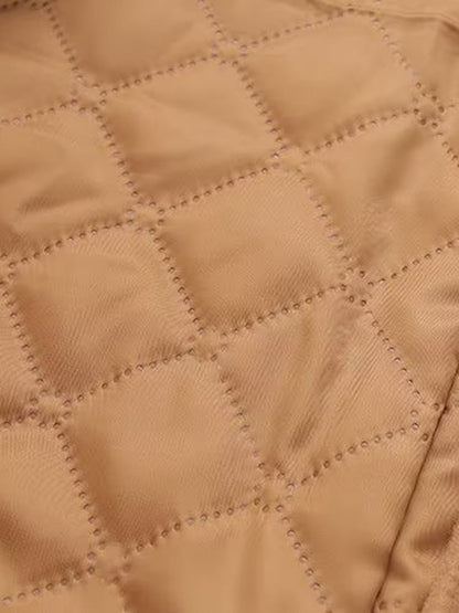 Diamond quilted lining inside a camel duffle coat