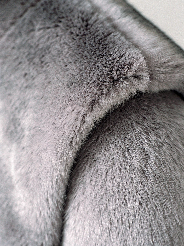 Close up of the soft dense faux fur pile of the gilet