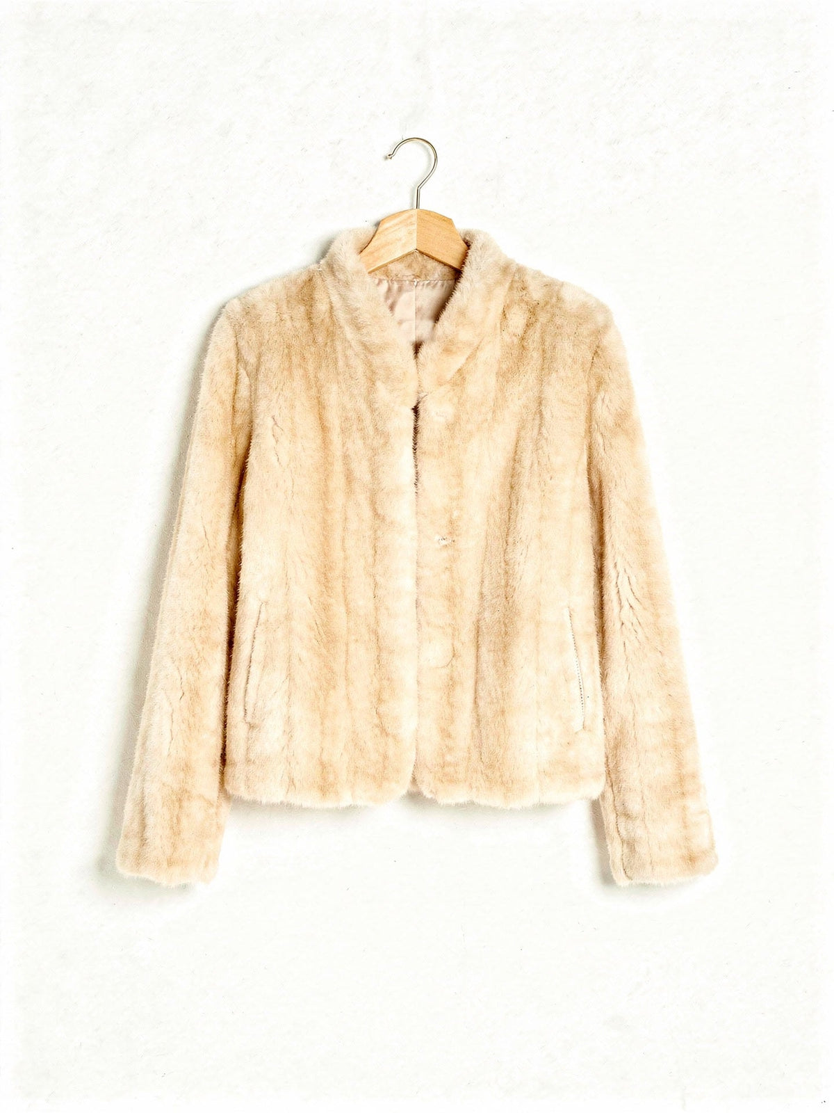 Faux fur jacket in Palomino, a pale warm blonde, shown front on against a white background