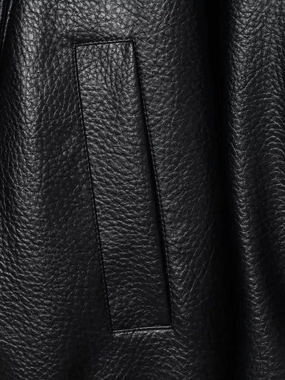 Grained faux leather texture and welt pocket close-up