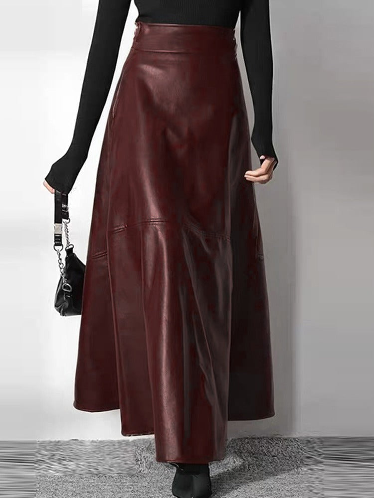 Faux leather maxi skirt in garnet seen from the back, showing the panel seams and the plain waistband