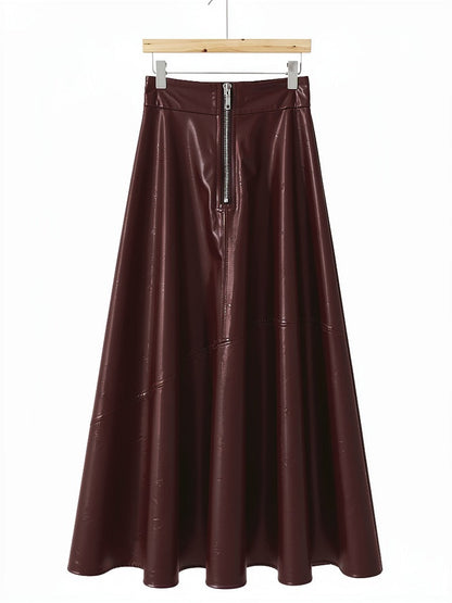 Faux leather maxi skirt in garnet on a hanger, exposed front zip and high waistband