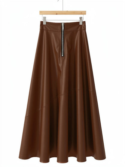Faux leather maxi skirt in saddle brown on a hanger, exposed front zip and full A-line hem