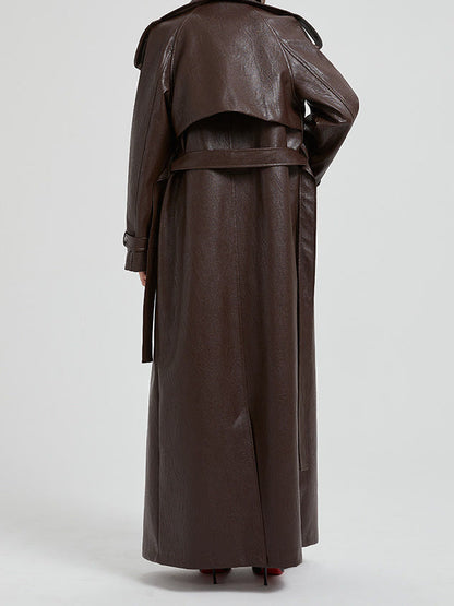 Back view of the faux leather trench coat showing the storm flap and tie belt