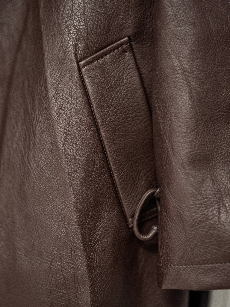 Close up of the faux leather grain and the hip welt pocket