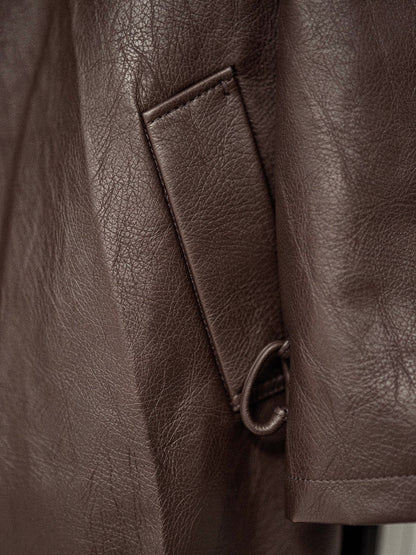 Close up of the faux leather grain and the hip welt pocket