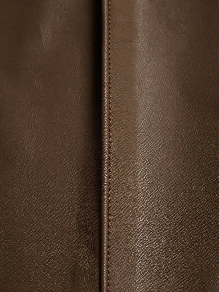 Close up of the coated faux leather finish and the pressed front crease