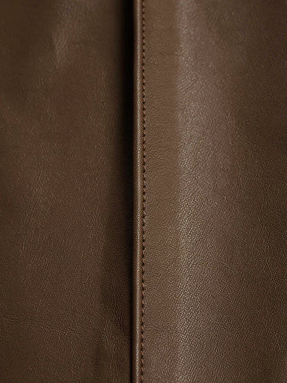 Close up of the coated faux leather finish and the pressed front crease