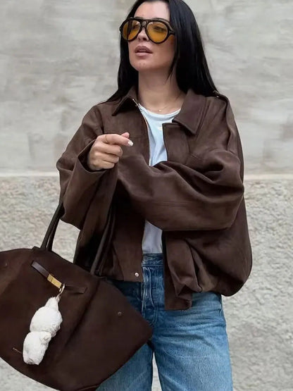 Chocolate brown faux-suede jacket worn open over a white tee