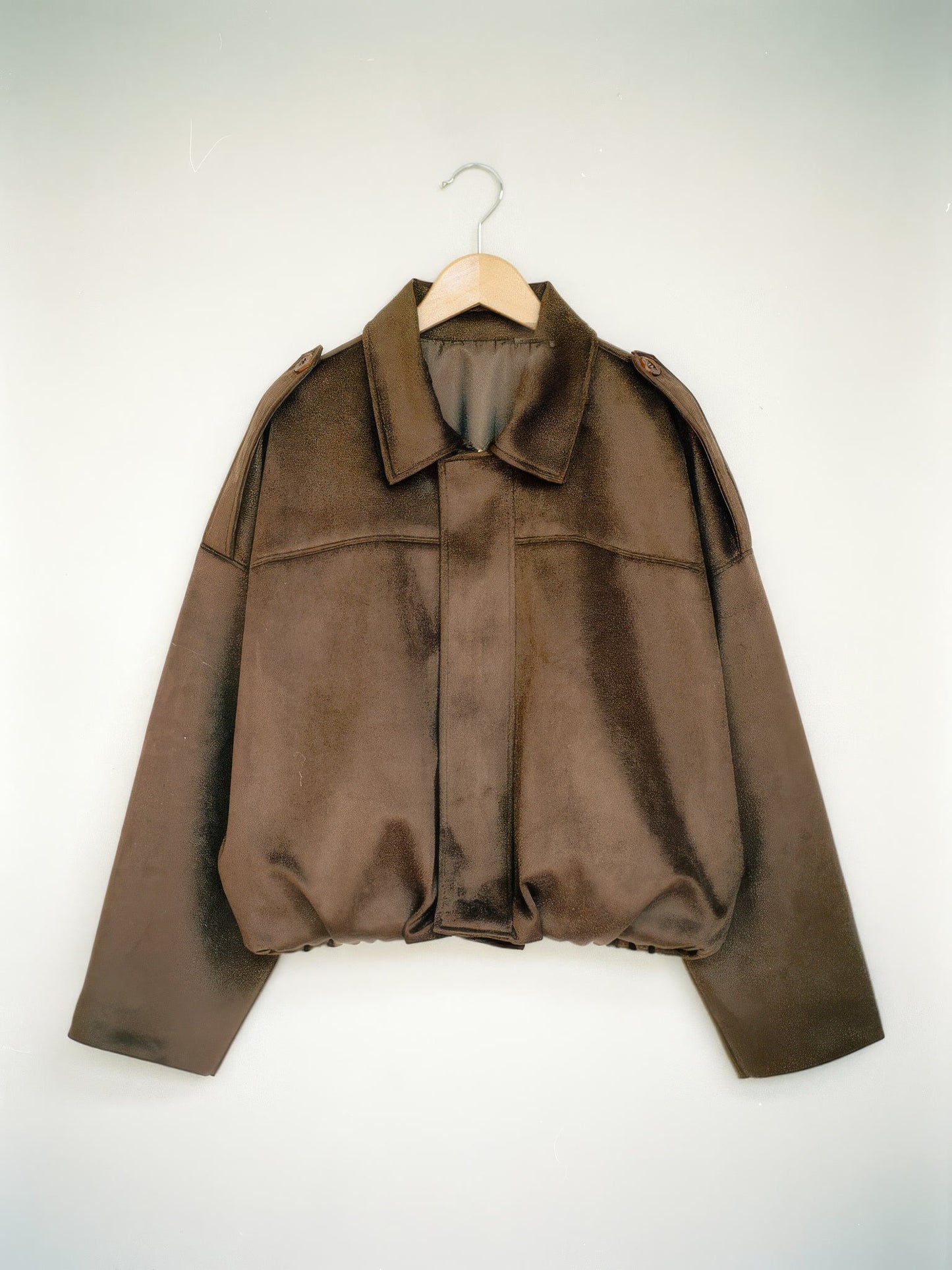 Walnut cropped faux-suede jacket with batwing sleeves on a wooden hanger