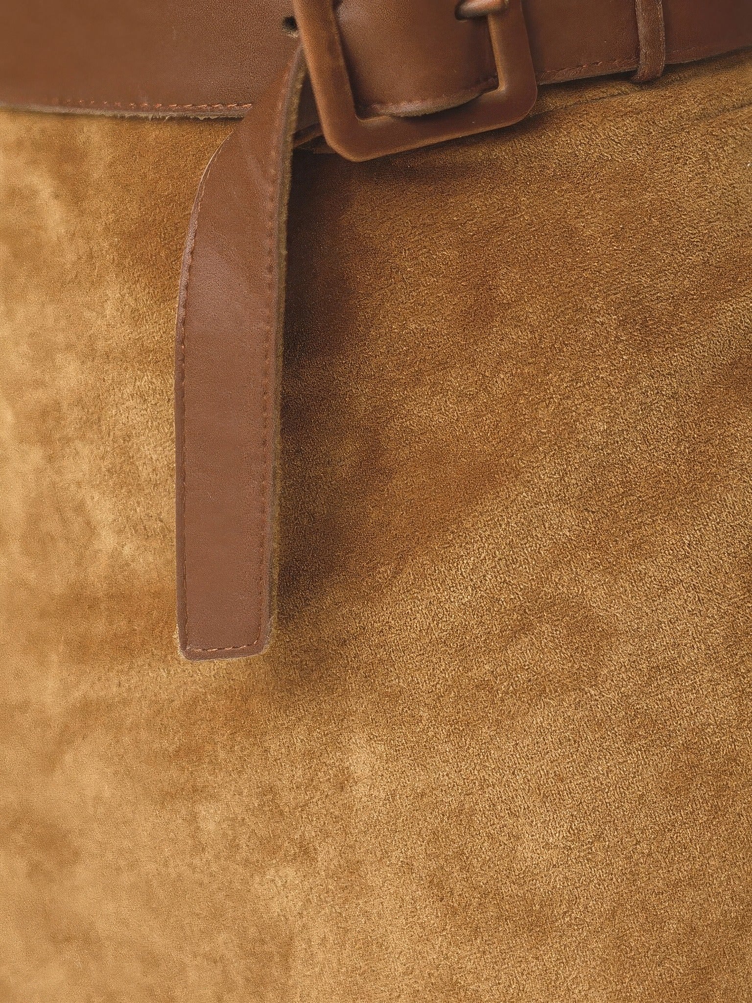 Close-up of the soft faux-suede fabric and leather-look belt