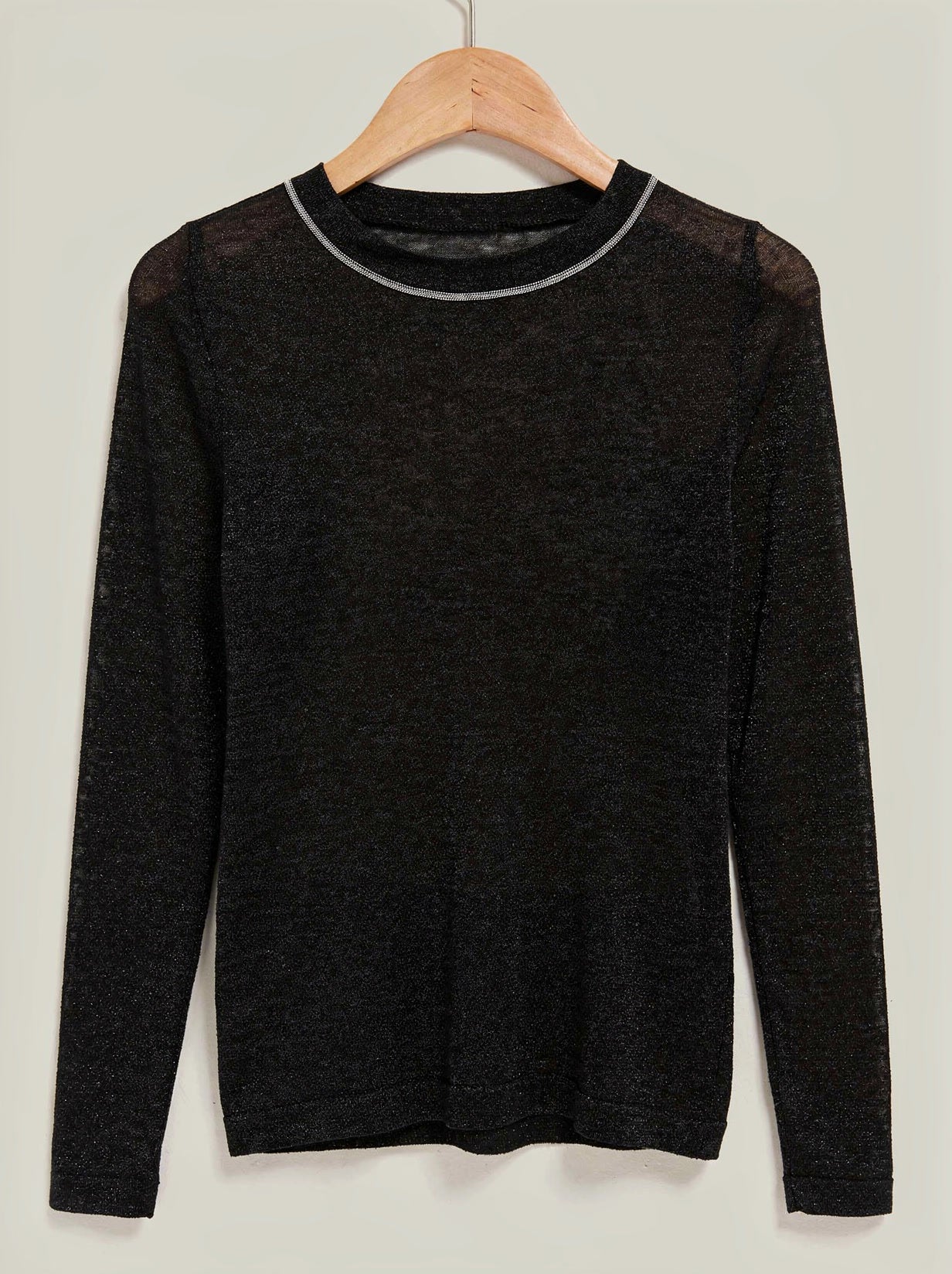 Black fine-knit shimmer jumper with a silver bead trim on a wooden hanger