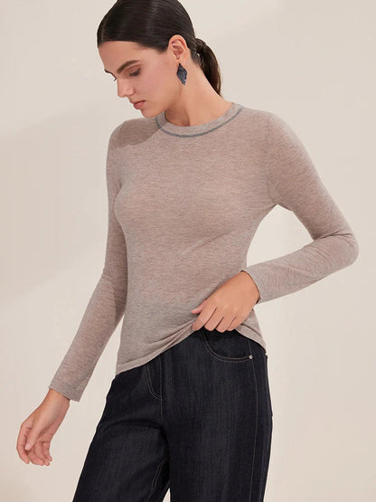 Rose taupe shimmer jumper worn close to the body, fitted silhouette