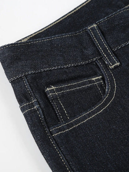 Close-up of the gold-tone topstitching and front pocket of the Foxton flared jeans