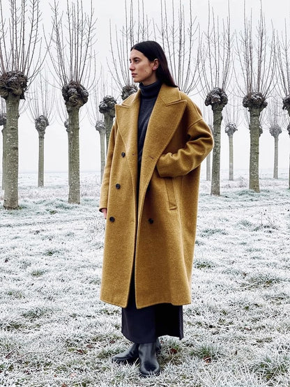 Funnel neck coat in Chanterelle camel, collar folded open into a wide revers