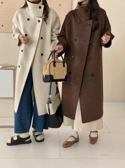 The funnel neck coat worn in Tallow cream and in Bulrush brown