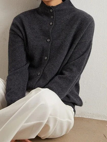 Grey cashmere cardigan buttoned to the stand collar, supplier photograph