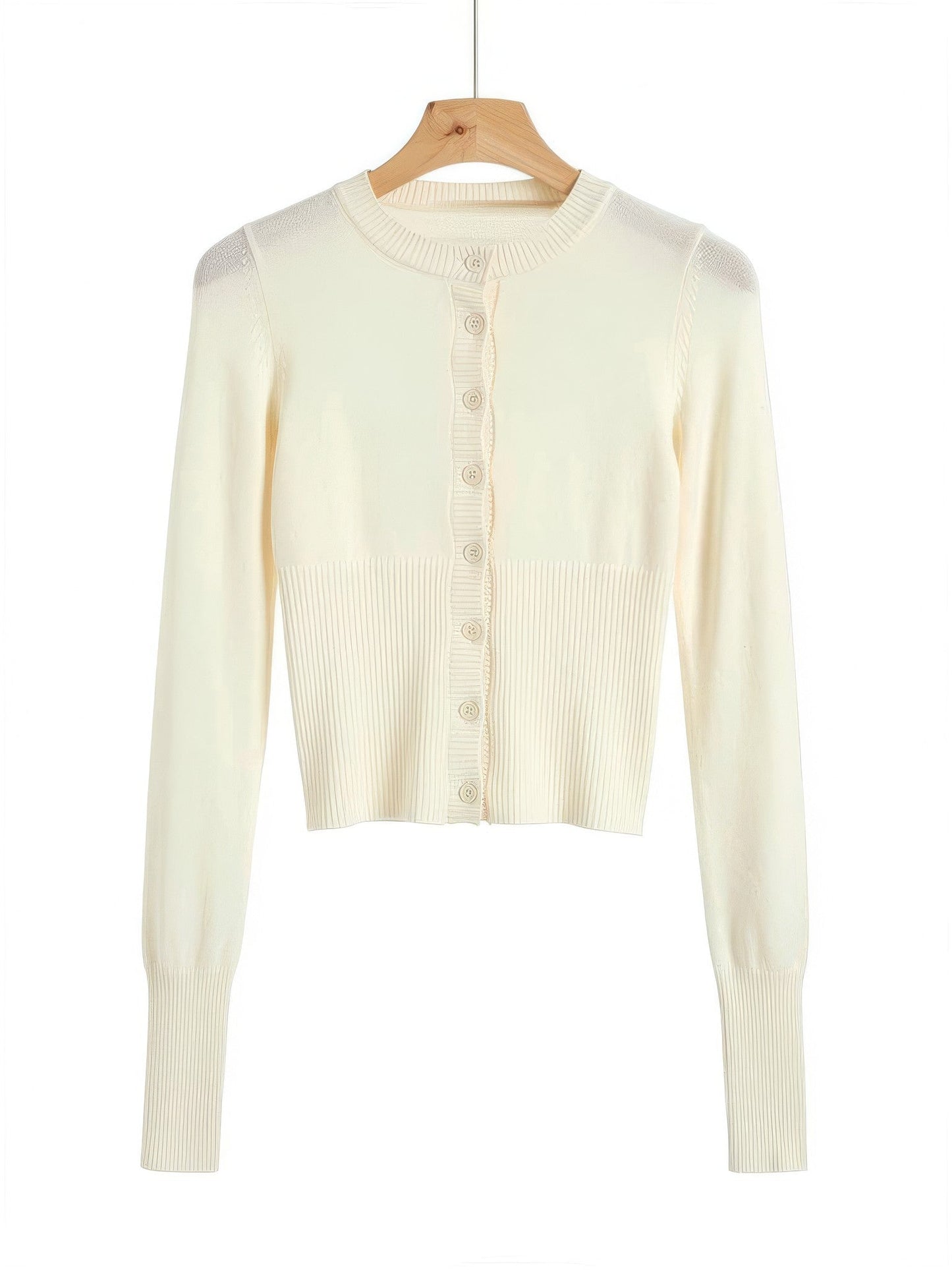 Buttermilk cropped cardigan with a scalloped rib button placket on a wooden hanger