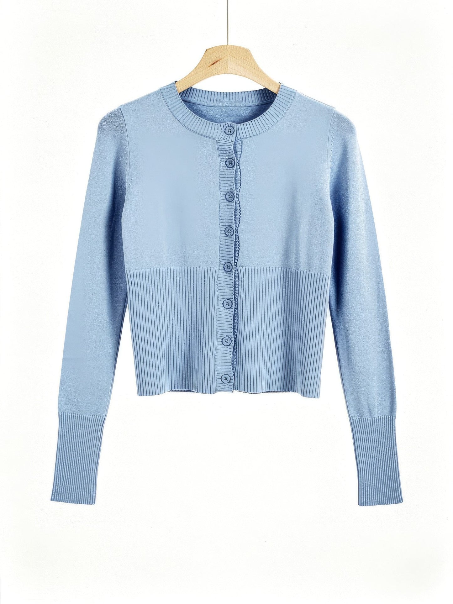 Powder blue cropped ribbed cardigan on a wooden hanger