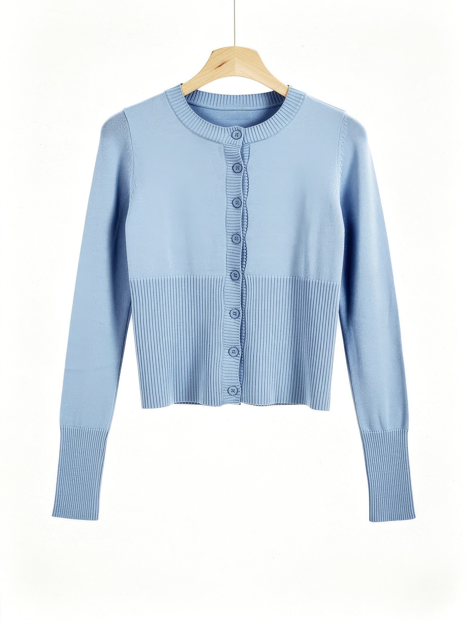 Powder blue cropped ribbed cardigan on a wooden hanger