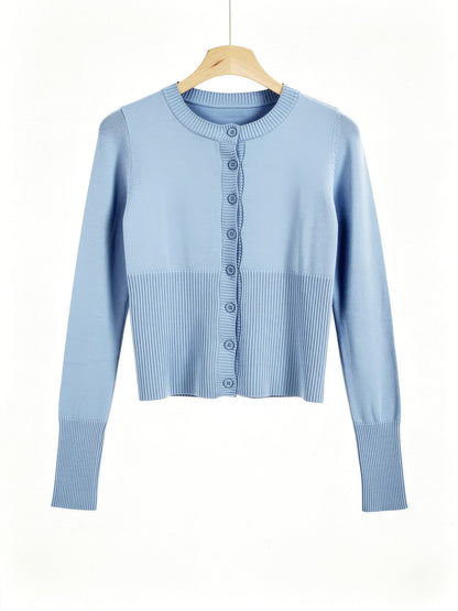 Powder blue cropped ribbed cardigan on a wooden hanger