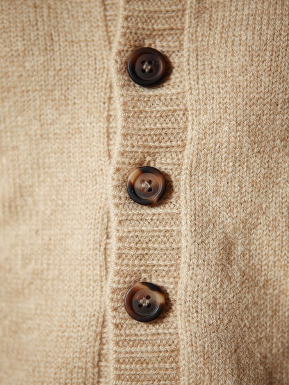 Close-up of the fine wool knit and horn buttons