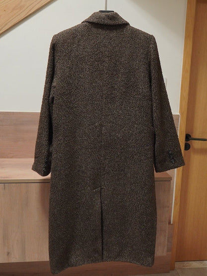 Back of the herringbone coat showing the single centre vent