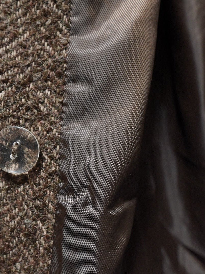 Satin lining and inner button of the double-breasted herringbone coat
