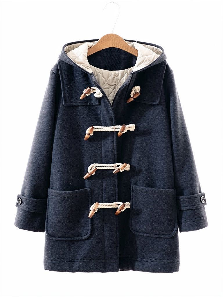 Navy hooded toggle coat in Admiral on a hanger, quilted hood lining showing