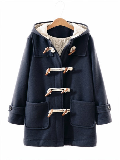 Navy hooded toggle coat in Admiral on a hanger, quilted hood lining showing