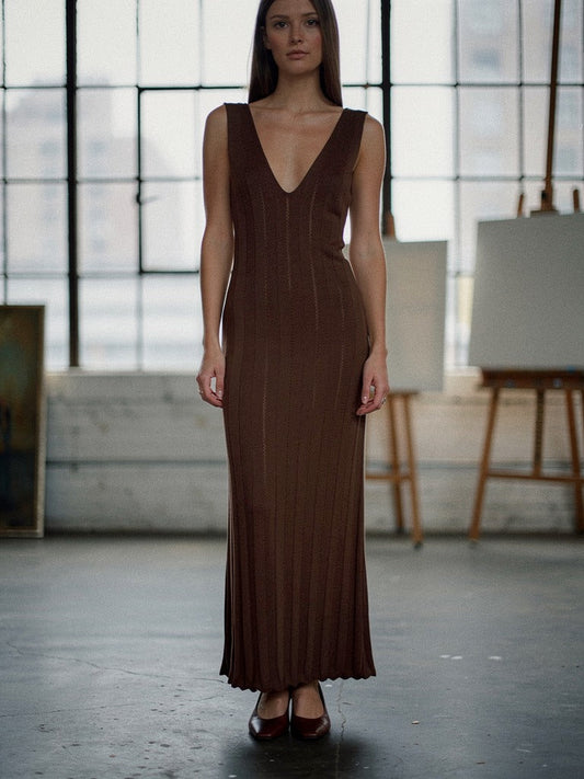 Knit dress in Clove worn full length in a north facing artist's studio