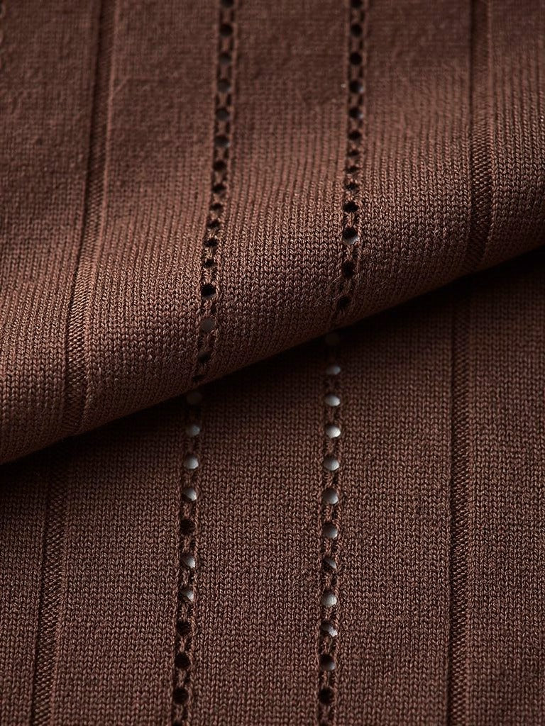 Close up of the vertical pointelle openwork ladders of the knit dress